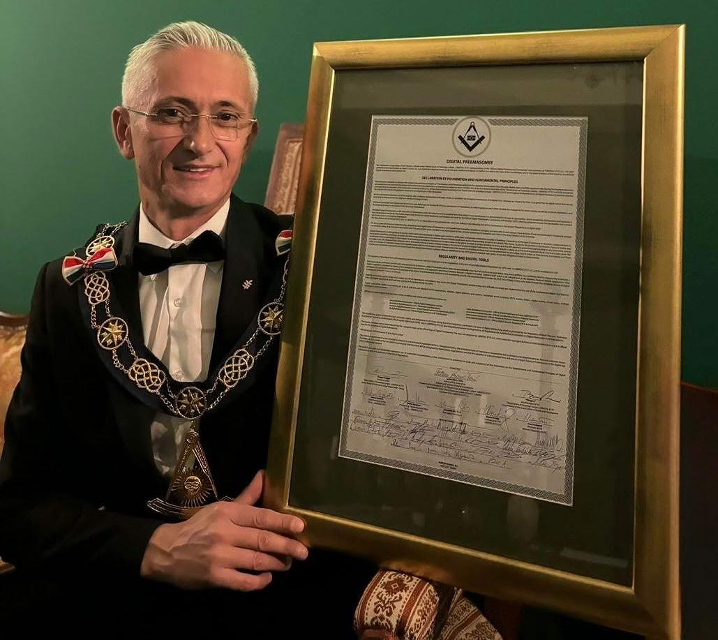 Zoran Vojnić Tunić holding the framed original Declaration